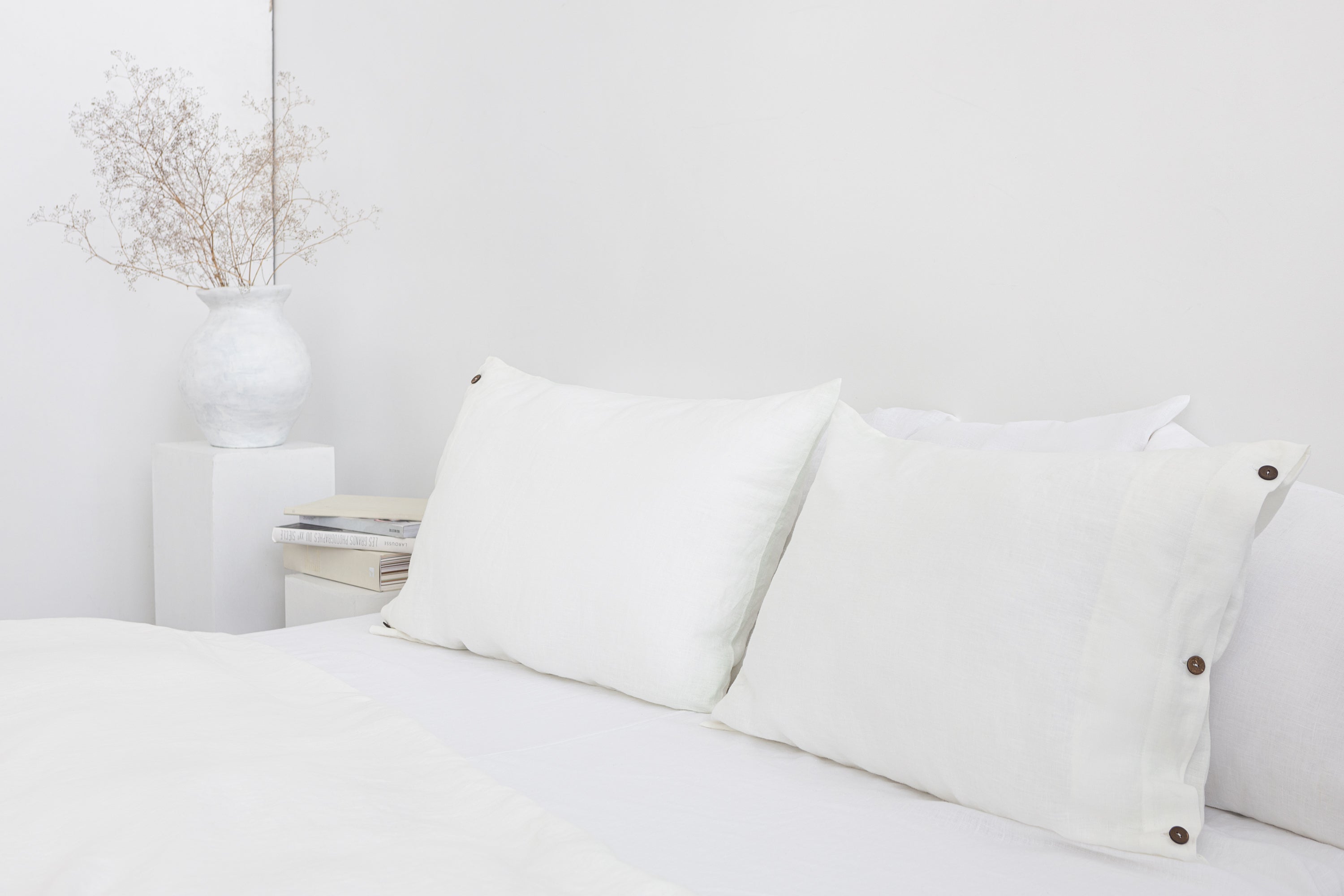 White linen bedding set with coconut buttons