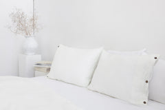 White linen pillowcase with coconut buttons