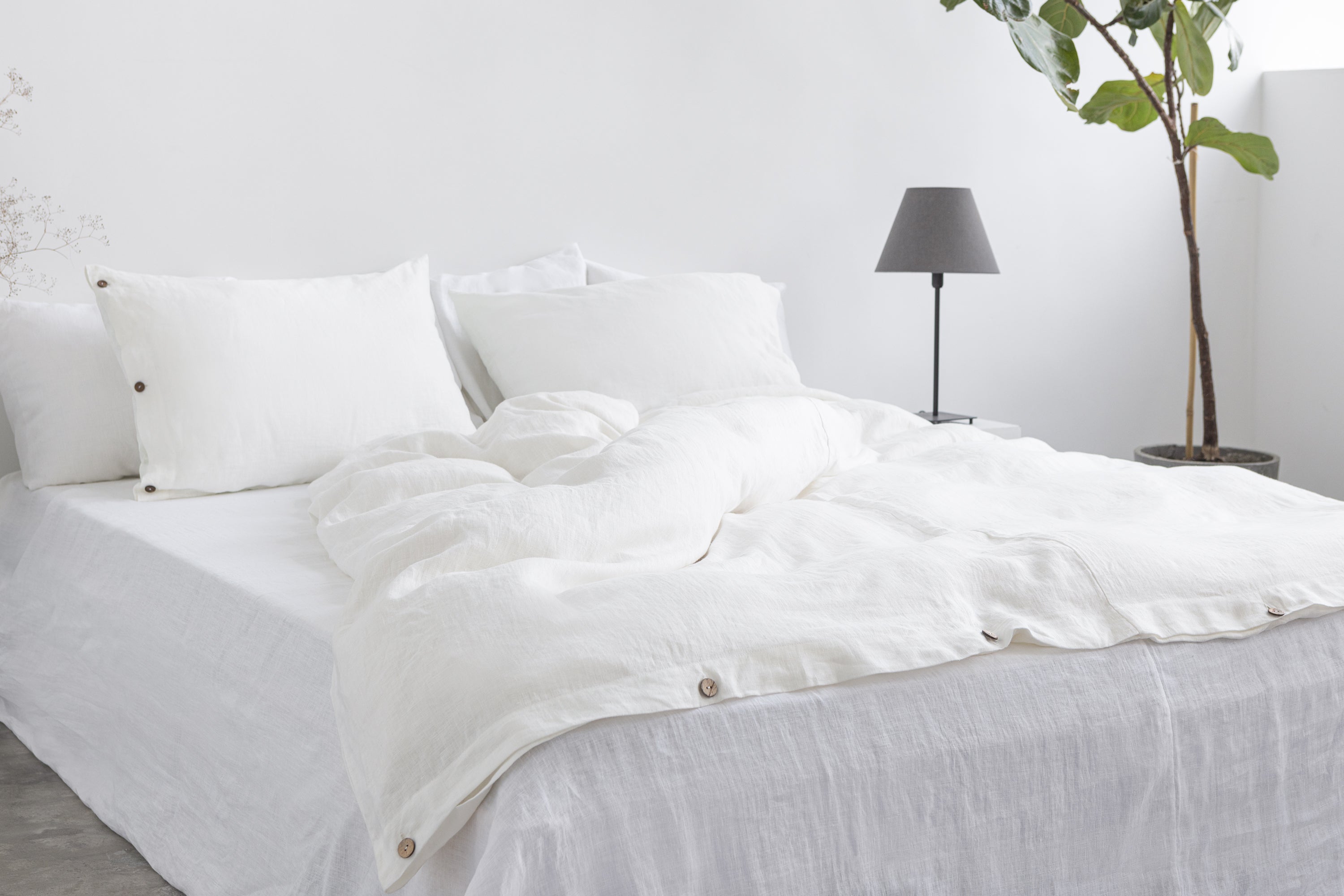 White linen pillowcase with coconut buttons